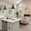 kitchen with large island and white cabinents